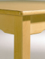 Preview: Trapeztisch mit Massivholzgestell, quadratische Tischbeine